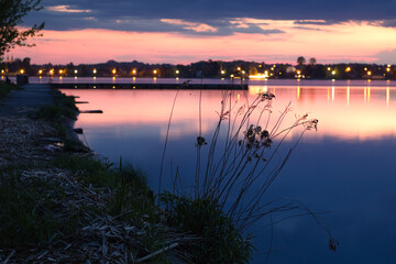 Pier on the lake at sunset. Holidays by the lake. Lake Zemborzyckie in the Lublin Poland. Zalew Zemborzycki w Lublinie. © Solar 760L