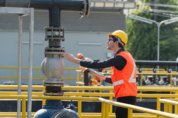 service engineer checking on waste water treatment plant with pump on background. worker working on Waste water plant.	