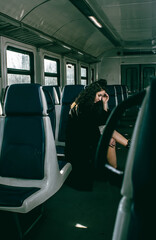 The girl is riding the train.