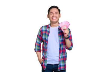 Smiling young Asian man in plaid shirt holding money banknotes and looking at camera isolated on transparent background