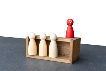 A minimalistic scene with five wooden figurines. Four natural wood-colored figurines stand in a row inside a dashed rectangular box