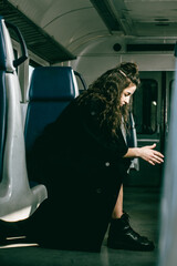 The girl is riding the train