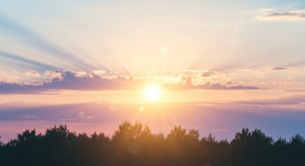 Obraz premium A glorious dawn: Golden sunburst over a horizon of tranquil pastel clouds