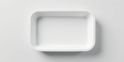 Empty white rectangular container on a light background, ideal for product presentation and showcasing various items.