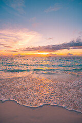 Colorful sunset sky calm waves on closeup sea sand shore. Panoramic tropical beach landscape. Inspire seascape horizon. Tranquil relax summer sun vibe. Best travel vacation serene meditation island © icemanphotos