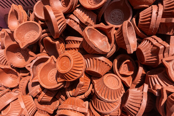 Bulk stock of red clay lantern, diya lamps, deepam lamps, clay oil lamps, karthigai deepam lamps, earthenware lamp, clay oil lamp selling at Srirangam temple, Tiruchirappalli, Tamil Nadu, South India.