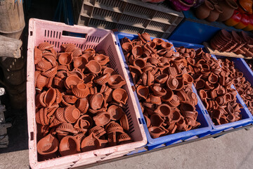 Bulk stock of red clay lantern, diya lamps, deepam lamps, clay oil lamps, karthigai deepam lamps, earthenware lamp, clay oil lamp selling at Srirangam temple, Tiruchirappalli, Tamil Nadu, South India.