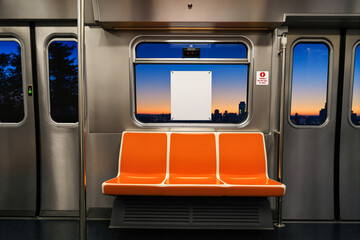 Fototapeta premium three-seater orange bench in public transport interior at sunset