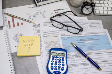 Text Need help on sticker Annual tax polish tax forms PIT-36 PIT-37 PIT-38 with pen calculator.