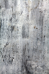 Rough scratched metallic surface texture with white paint