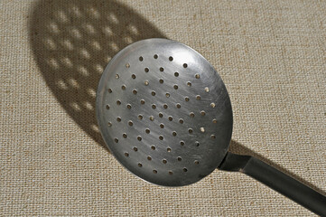 perforated skimmer and its shadow
