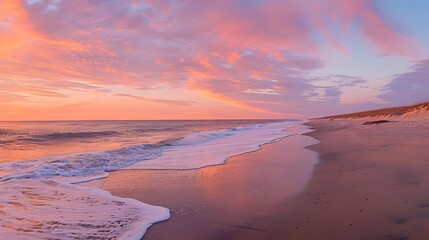 Fototapeta premium Serene Sunset: Waves Gently Crashing on Sandy Shore at Dusk, Painting the Sky with Vibrant Hues of Pink and Orange, Creating a Tranquil Coastal Scene. Peaceful Ocean Vista with Breathtaking Colors.