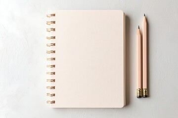 Pale Pink Notepad with Pencils and Binder Clip on Textured Background