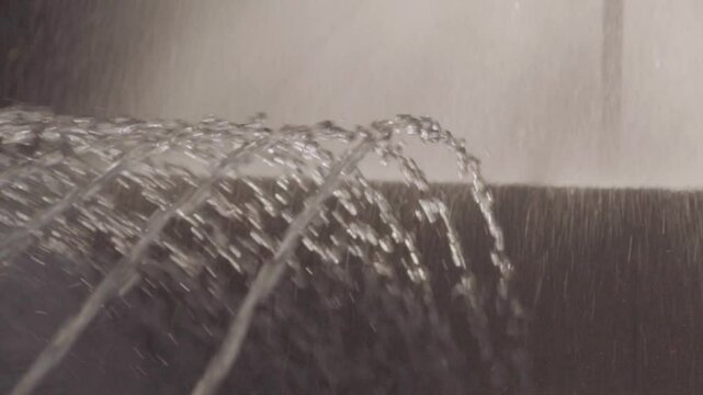 Close-up of fountain jets in slow mo in summer.