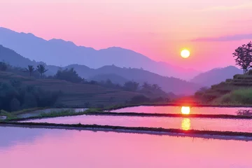 Fototapeten Pink Sunset Reflecting on Flooded Rice Terraces and Mountains © supri