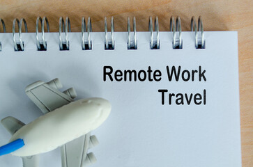 Remote Work Travel text on white notepad. Green travel planning and environmental awareness