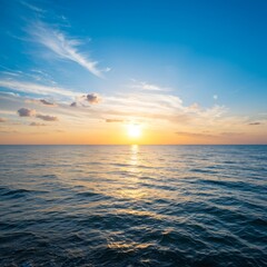 Obraz premium Serene Ocean Sunset with Golden Hues