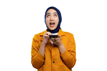 Excited young Asian woman pressing her finger on smartphone and looking up with surprised expression isolated on transparent background