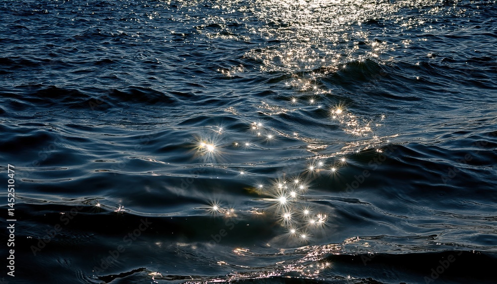 Fototapete sunlight reflections on dark ocean waves with sparkling highlights for nature backgrounds, website h