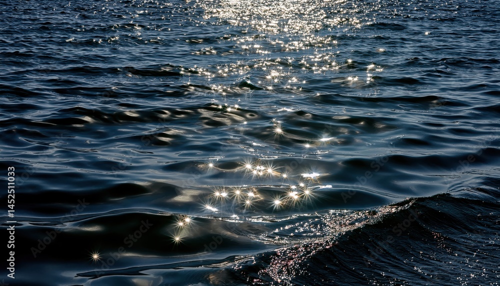 Leinwandbilder sunlight reflections on dark ocean waves with sparkling highlights for nature backgrounds, website h