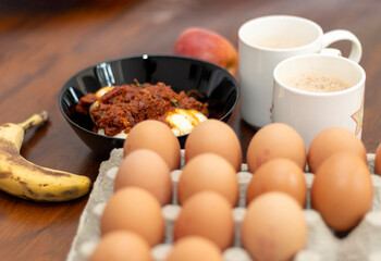 Egg Roast with Milky Tea And Fruits And Egg Tray on Foreground