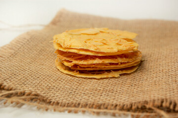 Almond crispy cookies with grated cheese, thin texture, isolated on white background