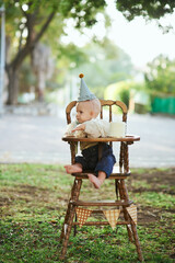 Boy crash his first smash cake in the park