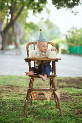 Boy crash his first smash cake in the park