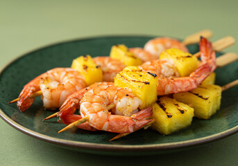 Grilled Shrimp and Pineapple Skewers on Green Plate