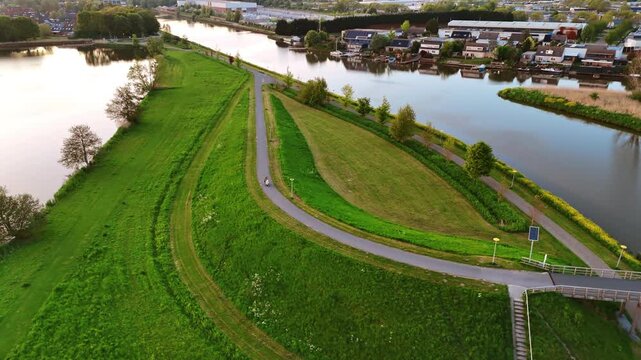 Canals with boats at the waterfront in Vinkeveen, the Netherlands. Drone footage over the picturesque village on the water. Aerial view.