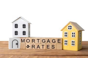 A new concept of loan and credit interest. Apartments, housing and house. Real estate market analysis concept. Business and finance. Wooden blocks with the words Rates mortgage and houses