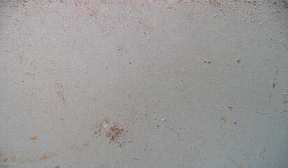 Close-up of a distressed, textured surface with subtle variations in color.