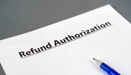 Refund Authorization Document on Table with Blue Pen  