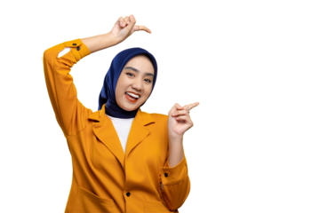 Cheerful young Asian woman pointing finger at empty copy space isolated on transparent background