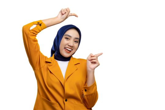 Cheerful young Asian woman pointing finger at empty copy space isolated on transparent background
