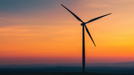 Obraz premium Wind Turbine at Sunset with Vibrant Sky and Scenic Landscape View