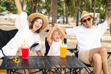 A little happiness of a lovely family with a summer vacation, having fun on the beach, clear sky.