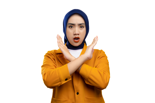 Annoyed young Asian woman with crossed arms showing stop or rejection gesture isolated on transparent background