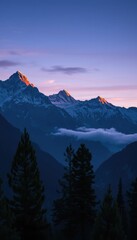 Obraz premium majestic alpine peaks under a rich blue-purple sky moments before sunrise
