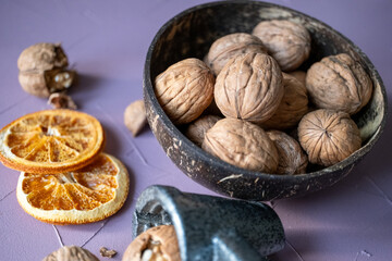 shelled walnuts and metal nutcracker in close-up	
