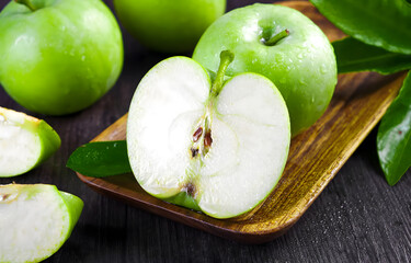 Fresh green apple with water drops