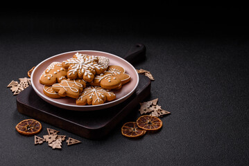 Christmas winter gingerbread, holiday biscuits on monochrome background