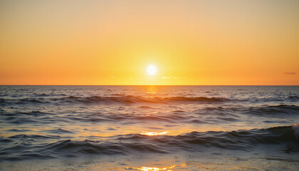 Obraz premium Serene sunset over ocean waves reflecting golden light 