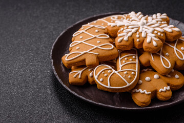 Christmas winter gingerbread, holiday biscuits on monochrome background