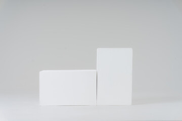 Minimalist Display: A clean, simple studio shot features two pristine, geometric blocks, perfect for showcasing products, designs, or concepts with elegance and modernity.