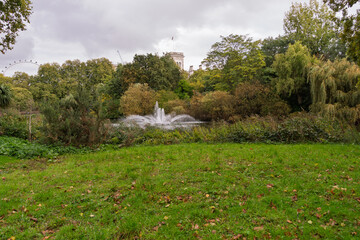 A park with a fountain in the middle of it