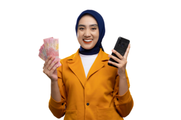 Cheerful young Asian woman holding mobile phone and money, looking at camera with happy expression isolated on transparent background