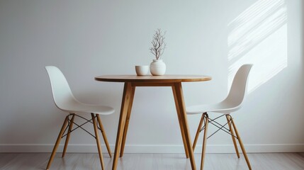 Scandinavian wooden table with two white chairs on white background.