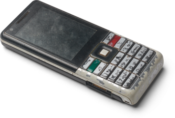 old obsolete mobile phone isolated white background, past generation handset cellphone with worn out physical keypad and scratched plastic