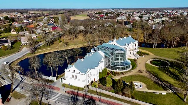 Kretinga museum with winter garden in Kretinga manor park in Samogitia, Lithuania. Aerial drone 4K video footage